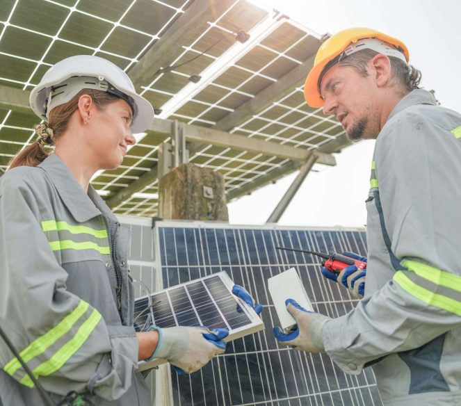 Factory engineers checking and repairing solar panel construction.Worker works at solar farm for renewable energy. .Concept of Renewable Energy Working. Specialists testing Photovoltaic cells module.